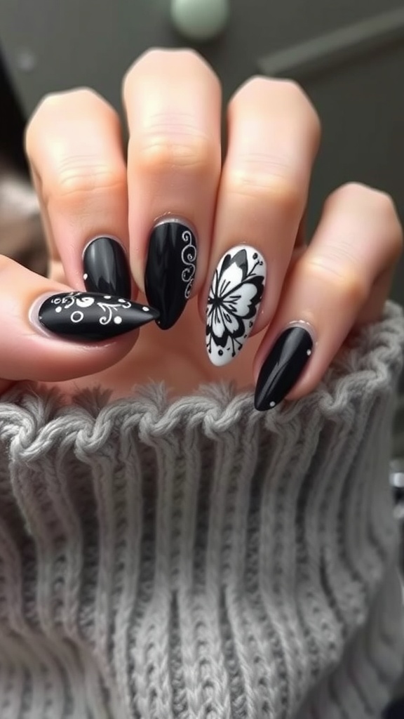 Close-up of black and white butterfly nail designs on hands.