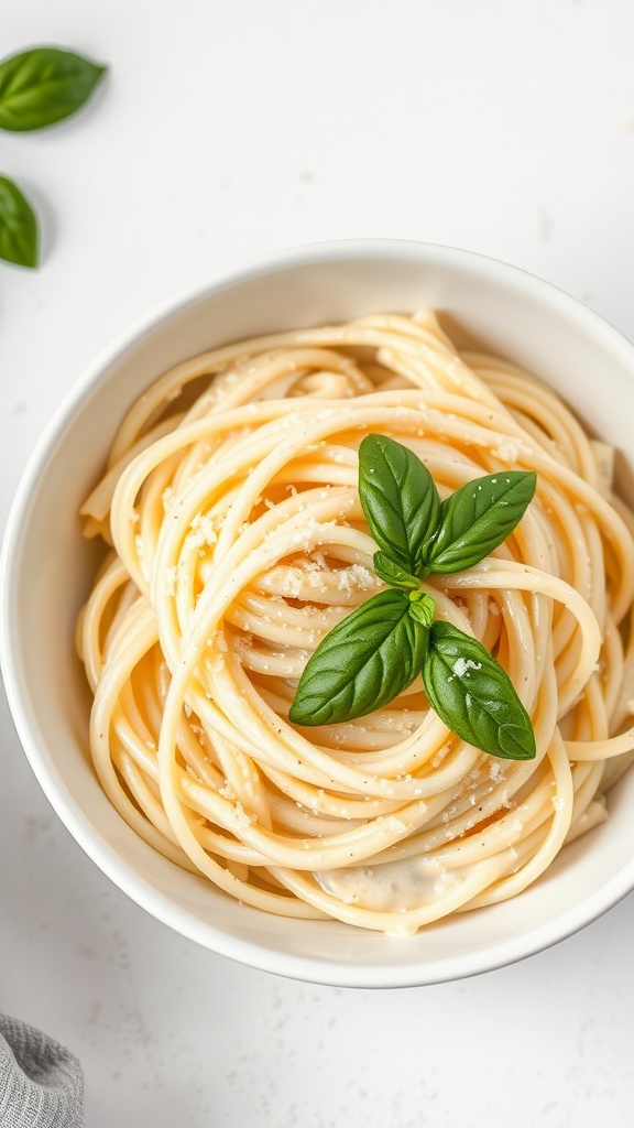 A bowl of creamy keto alfredo sauce pasta topped with basil leaves.