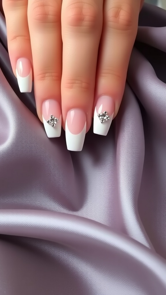 White French tip nails with rhinestones