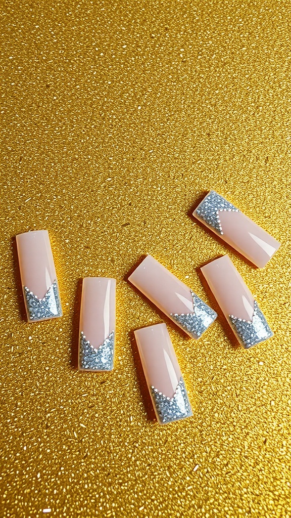 Square acrylic nails with glitter accents on a golden background.
