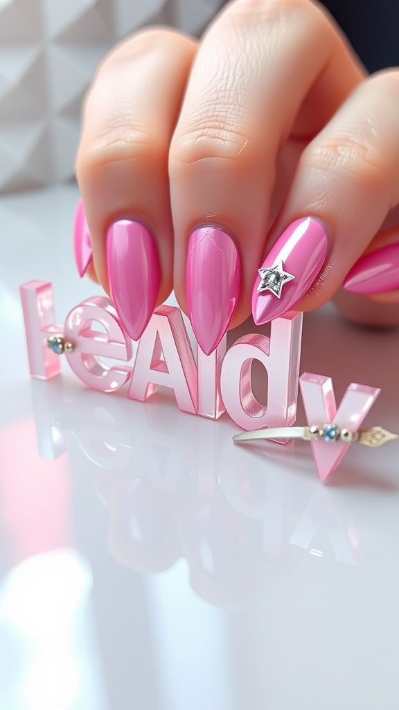 Close-up of pink chrome nails with 3D elements like stars and letters.