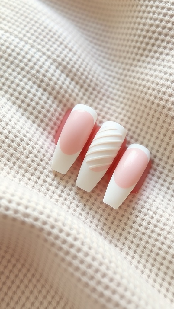 Textured white French tip nails with pink accents on a soft fabric background.